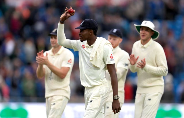 Jofra Archer is applauded by his England team-mates after his six-wicket haul