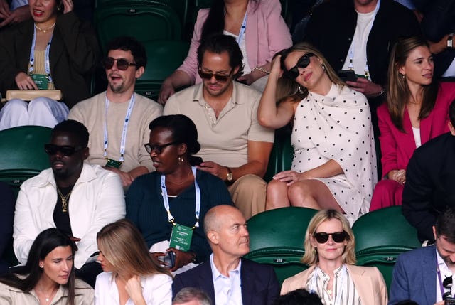 Daniel Kaluuya, Margot Robbie and Tom Ackerley watch on at Wimbledon