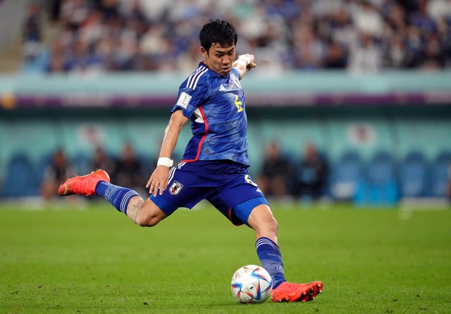 Wataru Endo kicks the ball playing for Japan
