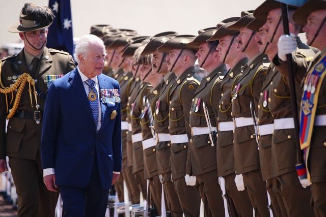 The King views the royal guard of honour during the ceremonial welcome at Australian Parliament House in Canberra 