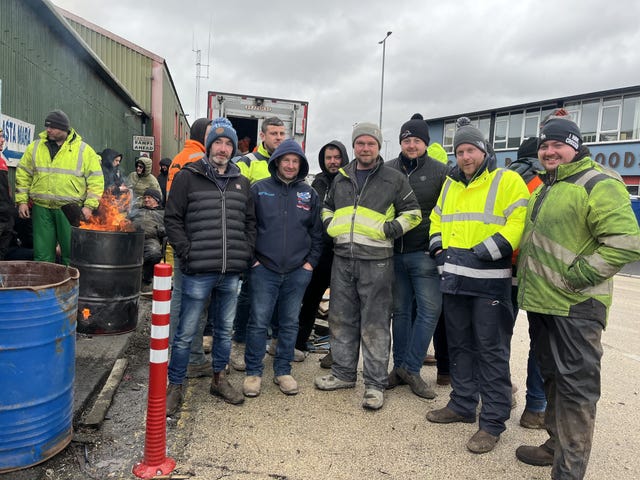 Worker Eoin Delaney (third from right) joins protesters taking part in a blockade at the docks in Galway Docks, Co Galway