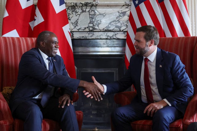 David Lammy smiling and shaking hands with JD Vance