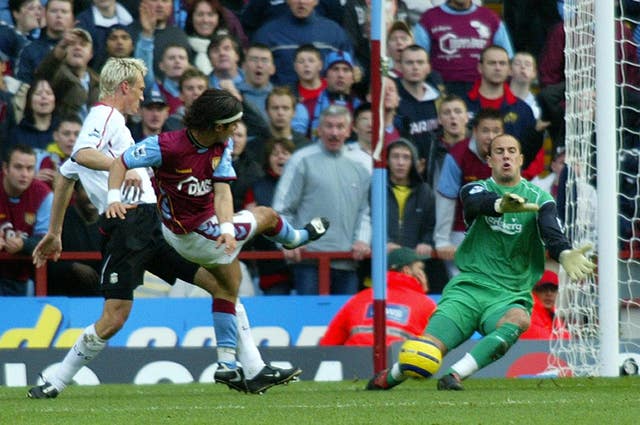 Liverpool's Pepe Reina makes a save against Aston Villa