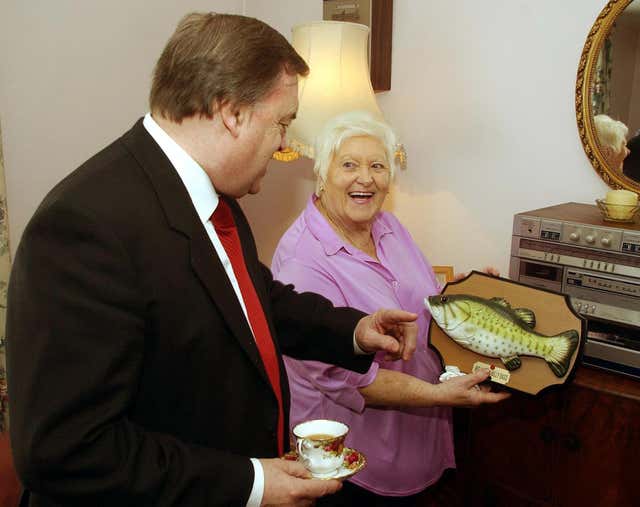 John Prescott with Molly Hammond and a Billy Bass singing fish