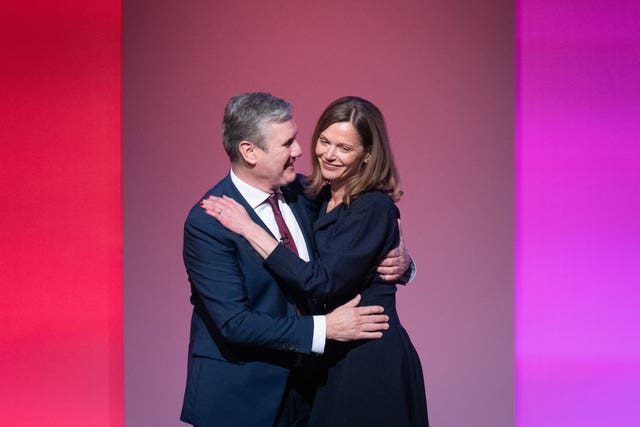 Labour leader, Sir Keir Starmer is joined by his wife Victoria on stage after delivering his keynote speech to the Labour Party conference (Stefan Rousseau/PA)