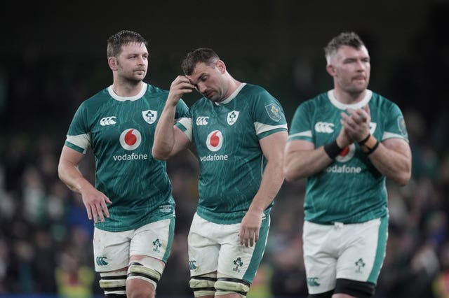 Iain Henderson, Tadhg Beirne and Peter O'Mahony, left to right, react to Ireland's defeat to New Zealand