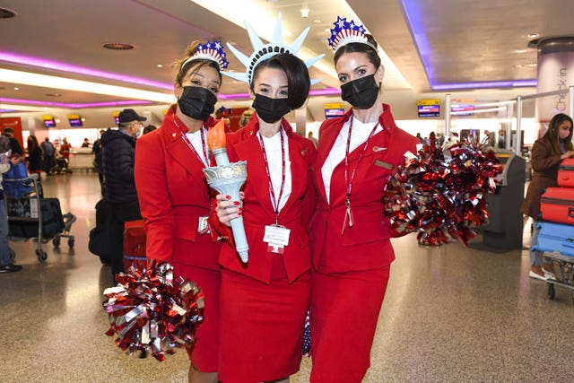 Virgin Atlantic cabin crew staff at London Heathrow Airport’s T3 ahead of the departure of Virgin Atlantic flight VS3, which will perform a synchronised departure on parallel runways alongside British Airways flight BA001, heading for New York JFK to celebrate the reopening of the transatlantic travel corridor 