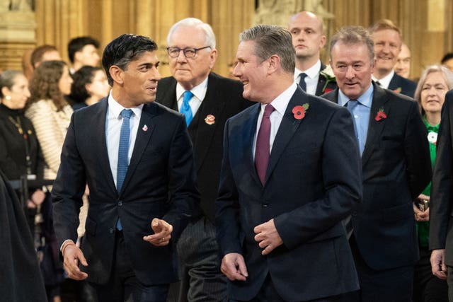 Prime Minister Rishi Sunak walks with Labour Party leader Sir Keir Starmer through the Central Lobby at the Palace of Westminster ahead of the State Opening of Parliament in the House of Lords in November 2023 
