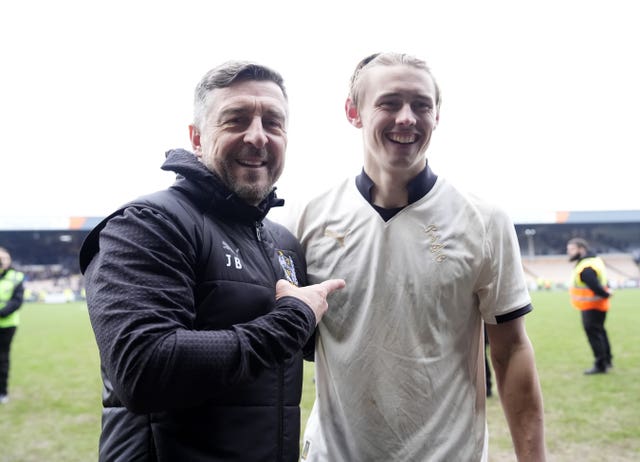 Port Vale boss Jon Brady, left, and Ben Waine celebrate