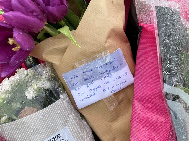 Flowers and messages left at the scene in Bluntisham, Cambridgeshire