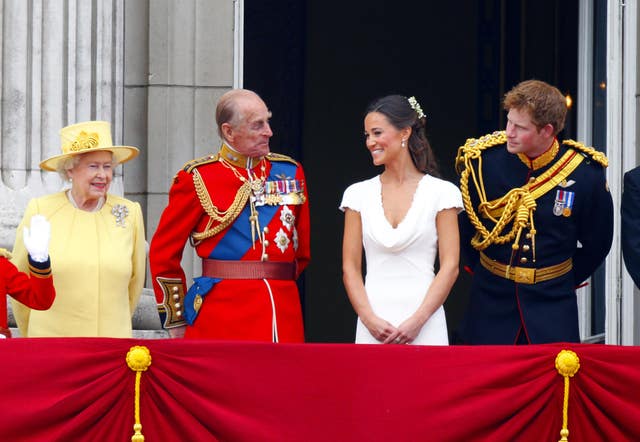 The Queen in yellow, the Duke of Edinburgh, Pippa Middleton and Prince Harry on the Palace balcony after William and Kate's wedding (Chris Ison/PA)