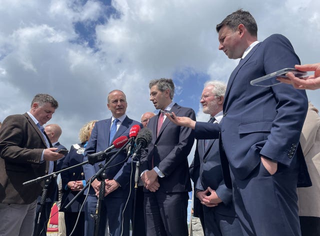 Tanaiste Micheal Martin and Taoiseach Simon Harris (centre) in Omeath in Co Louth to announce the start of construction of the Narrow Water Bridge cross-border project on June 4 2024 