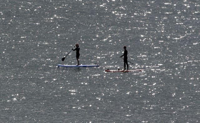 Two paddle boarders in the water