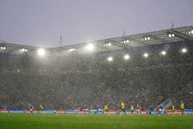 Leicester and Watford players do battle in the snow