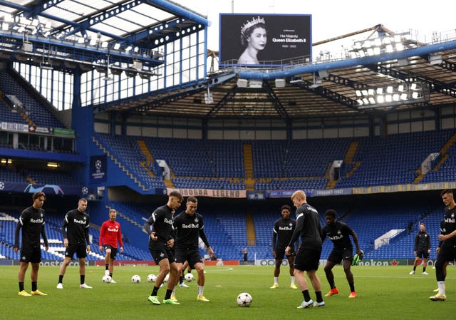 A tribute to the Queen is shown on the big screen at Stamford Bridge as RB Salzburg players train ahead of their Champions League match with Chelsea on Wednesday