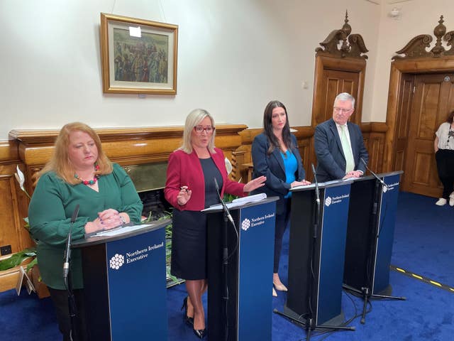 Naomi Long, Michelle O’Neill, Emma Little-Pengelly and Mike Nesbitt stand in a line during a press conference at Stormont Castle