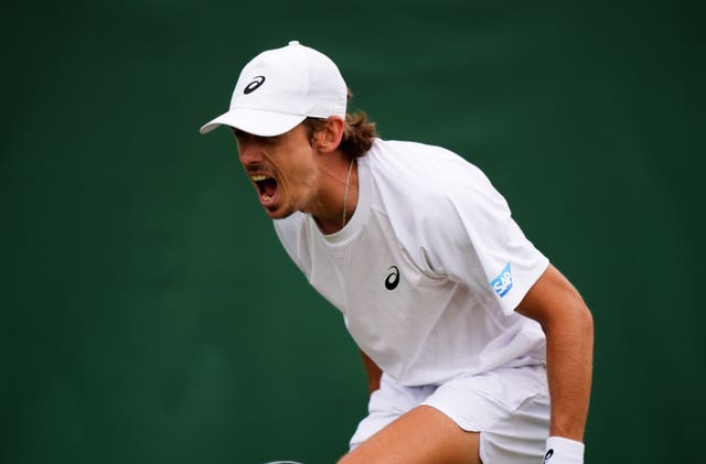 Alex De Minaur shouts in celebration