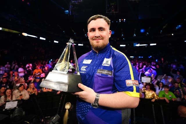 Luke Littler with the darts Premier League trophy