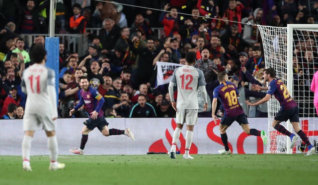 Lionel Messi, second left, celebrates scoring for Barcelona against Liverpool