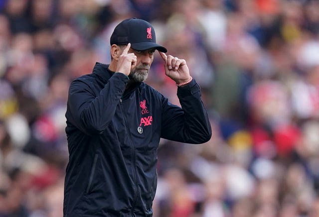 Liverpool manager Jurgen Klopp points to his head