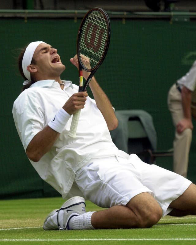 Federer celebrates beating Sampras at Wimbledon 