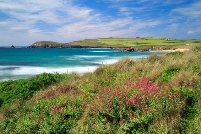 The National Trust cares for 775 miles of coastline, including Cornwall's Trevose Head, and says many beaches are affected by marine litter (John Miller/National Trust/PA)