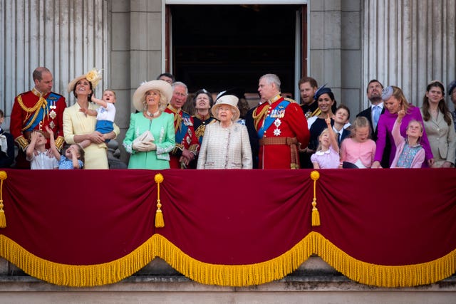 Queen Elizabeth II is joined by members of the royal family, on the balcony of Buckingham Place watch the flypast after the Trooping the Colour ceremony,