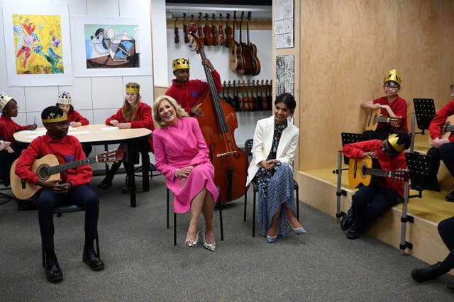 Jill Biden and Akshata Murty listen to a music class at Charles Dickens Primary School 