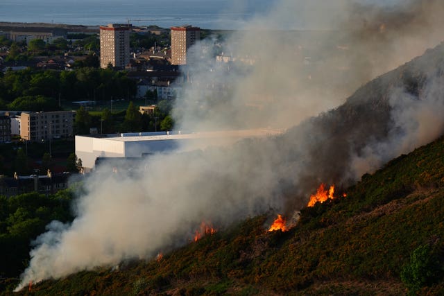 Flames and smoke rise from a fire close to the ruins of St Anthony&rsquo;s Chapel in Holyrood Park, Edinburgh