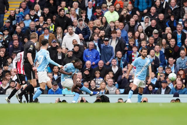 Manchester City’s Jeremy Doku, centre, scores their first goal against Brentford