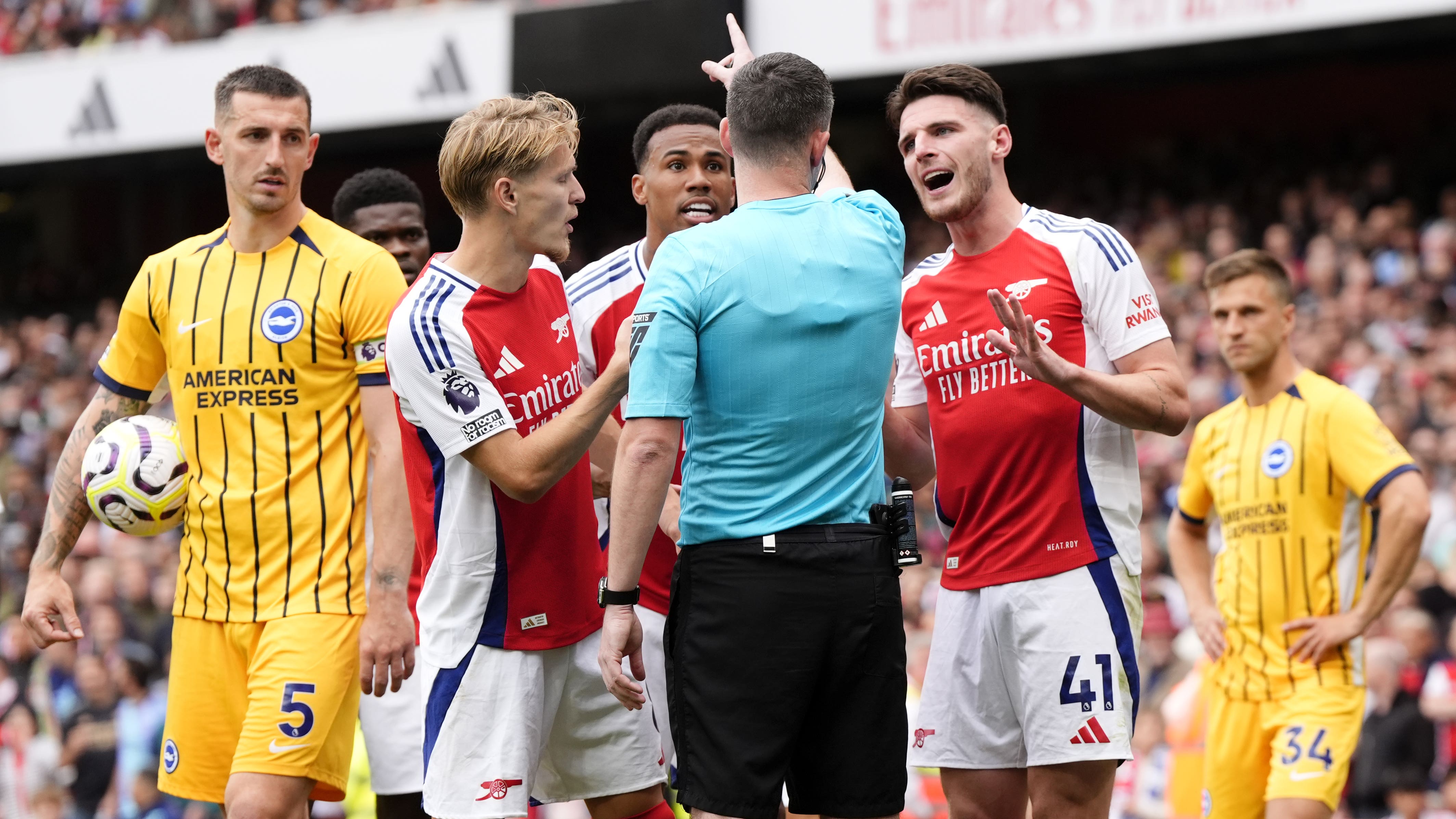 Declan Rice pleads his innocents after being shown a second yellow card by referee Chris Kavanagh against Brighton (Nick Potts/PA)