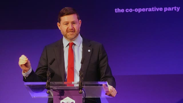 Jim McMahon speaking from a lectern