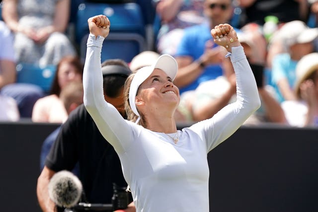 Yulia Putintseva holds up her arms after winning the Rothesay Classic in Birmingham