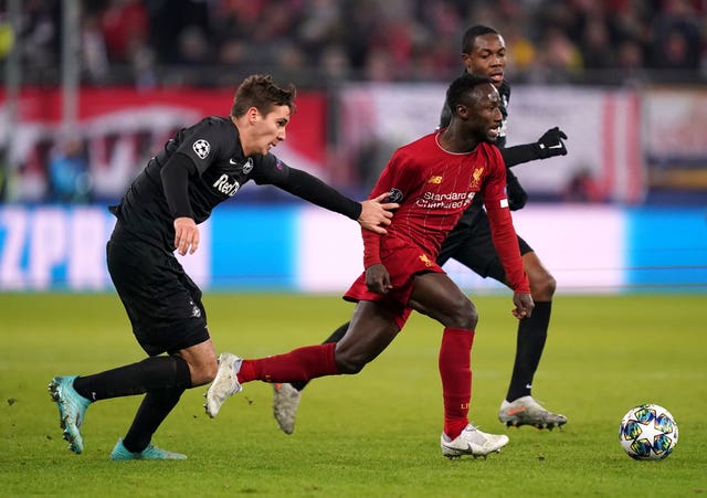 Liverpool midfielder Naby Keita runs away from Red Bull Salzburg’s Maximilian Wober