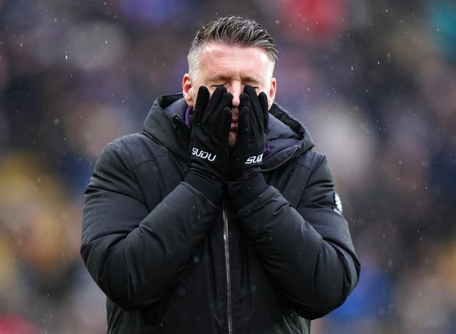 Rob Edwards covers his face