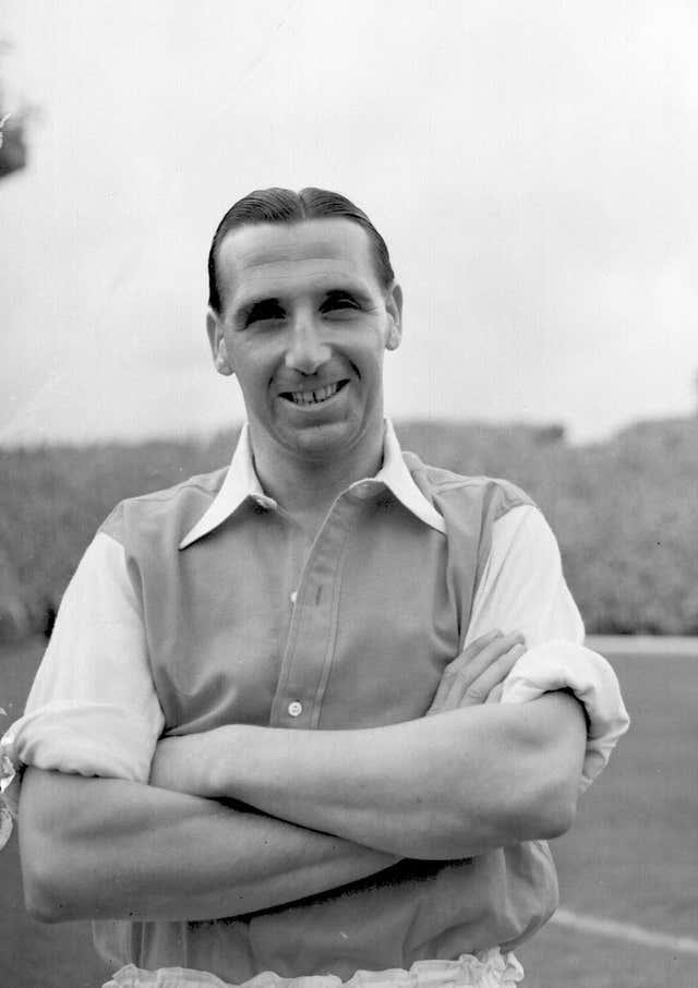 Tommy Lawton stands with his arms folded