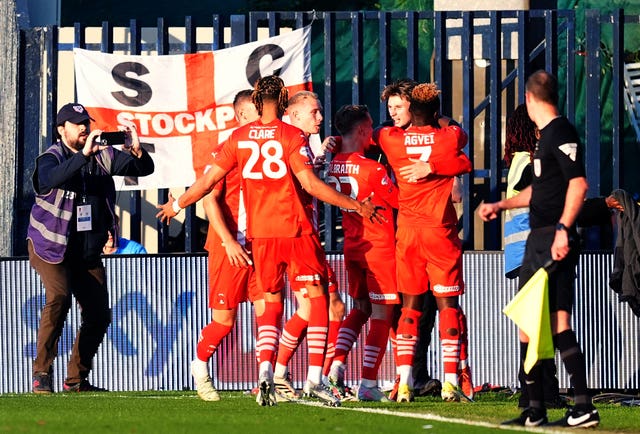 Oliver O'Neill (second right) celebrates scoring 