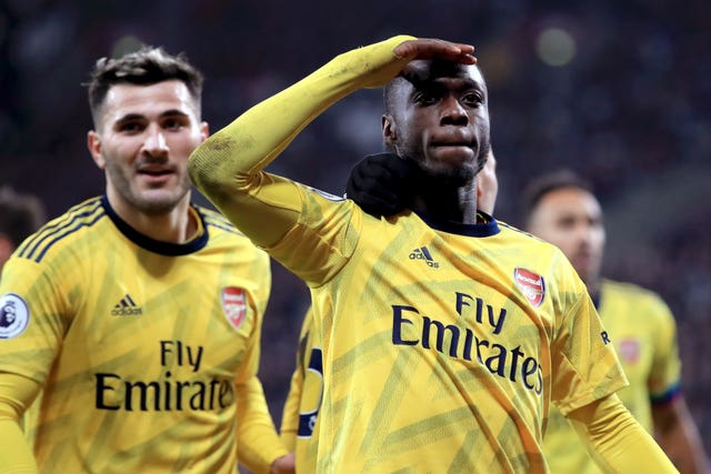 Nicolas Pepe, right, celebrates scoring at West Ham