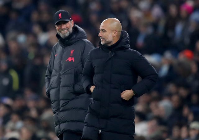 Manchester City manager Pep Guardiola, right, and Liverpool manager Jurgen Klopp 