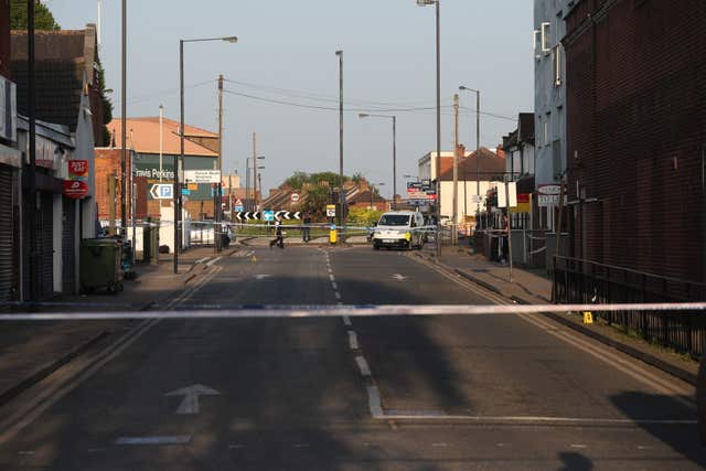 Police at Palmerston Road in Wealdstone after two boys were shot at two locations in close proximity (Jonathan Brady/PA)
