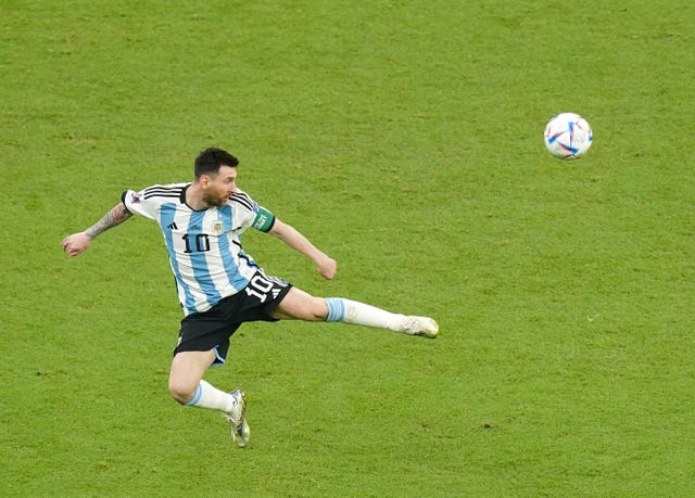 Lionel Messi controls the ball in the air