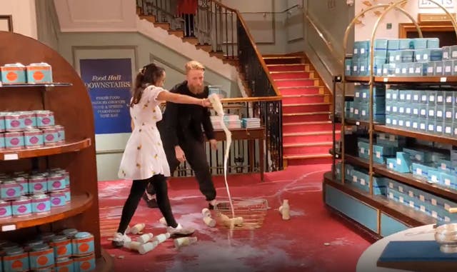 The Animal Rebellion protesters poured out milk on the carpet at Fortnum & Mason in London (Animal Rebellion/PA)