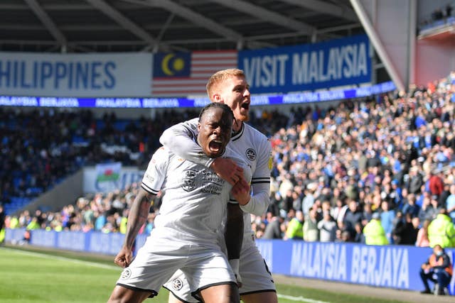 Michael Obafemi, front, celebrates his second goal in Swansea's win over Cardiff