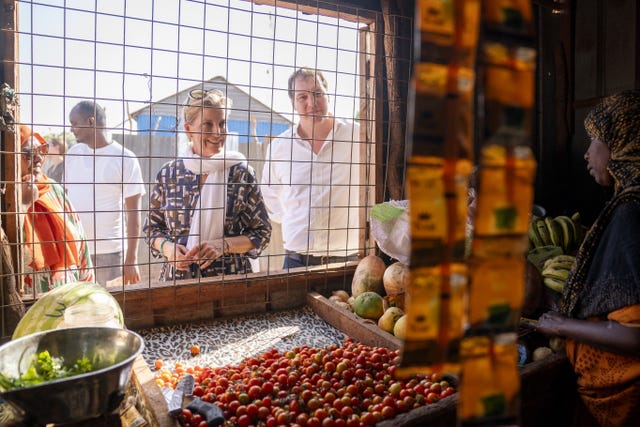 Sophie looks at fruit and vegetables through the window of a shop in a Somali village in Lower Shabelle 