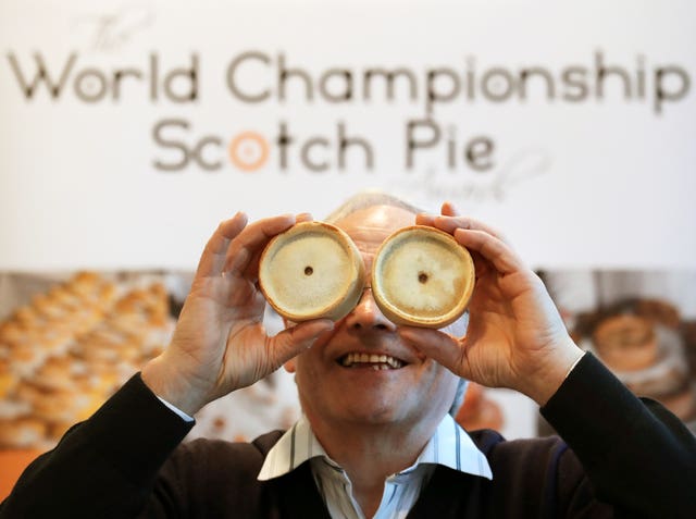 Kerr Little with two Scotch pies on his eyes