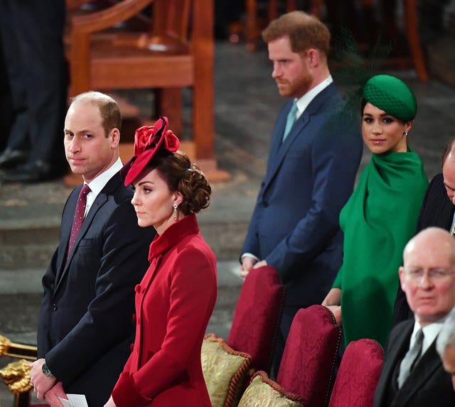 The Duke and Duchess of Sussex stand behind the Duke and Duchess of Cambridge at the Commonwealth Service at Westminster Abbey in 2020