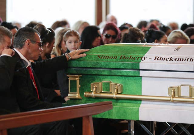 My Big Fat Gypsy Wedding star Paddy Doherty rests his hand on the coffin of his father Simon Doherty (Yui Mok/PA)