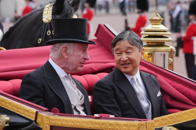 The King and Emperor Naruhito of Japan travelling together in a coach