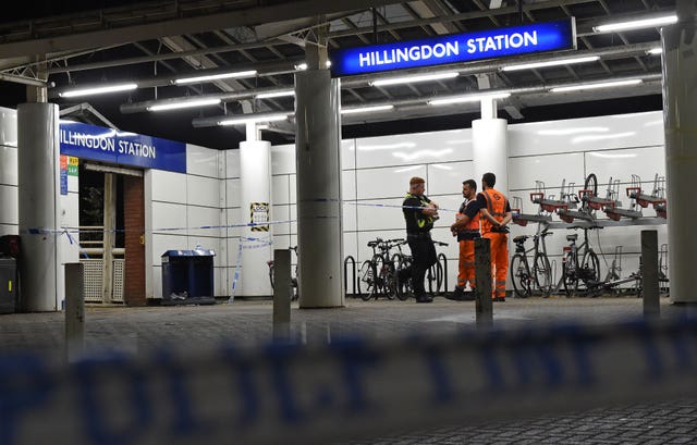 Police outside Hillingdon Underground station in London 