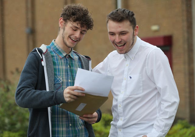 Cousins Tyler Crooks and Scott Chambers collect their results at Abbey Community College in Newtownabbey, Northern Ireland